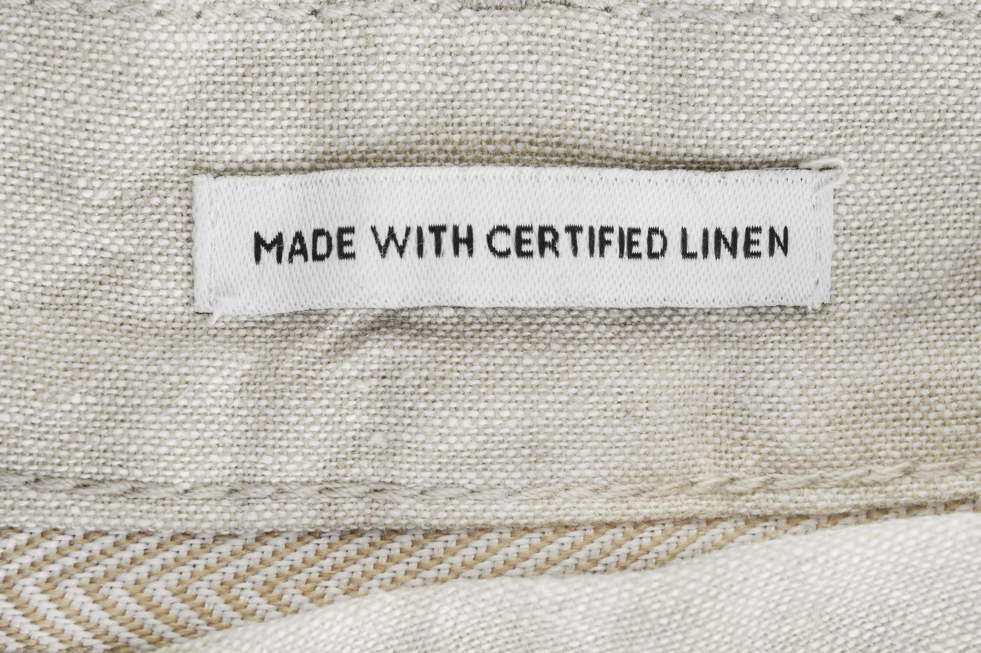 Embroidered label on natural cotton
