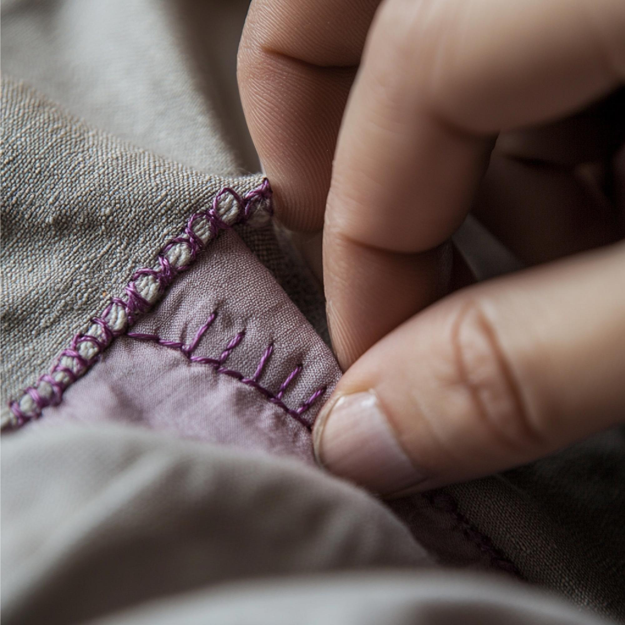 Close-up of hand embroidery on linen